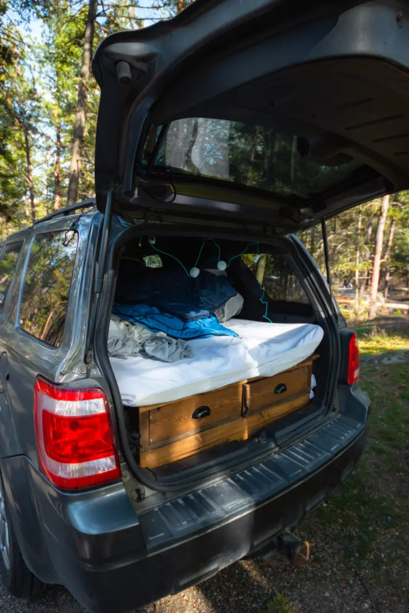 The back of a Ford Escape SUV turned into a camping setup
