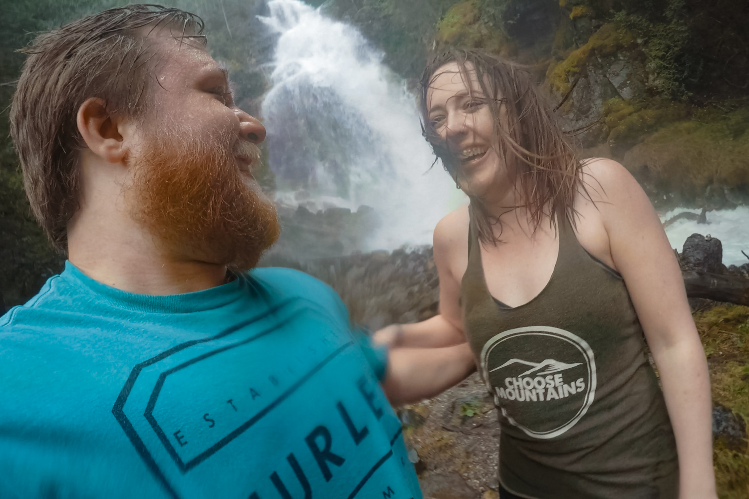 Two people take selfie and laugh in front of Kay Falls