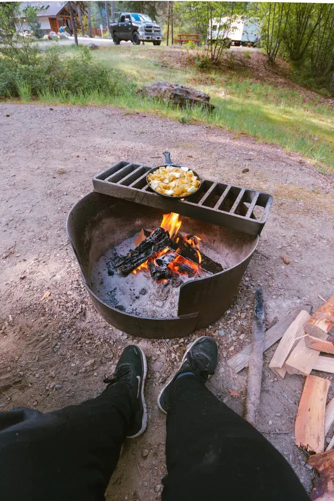 Feet near a campfire