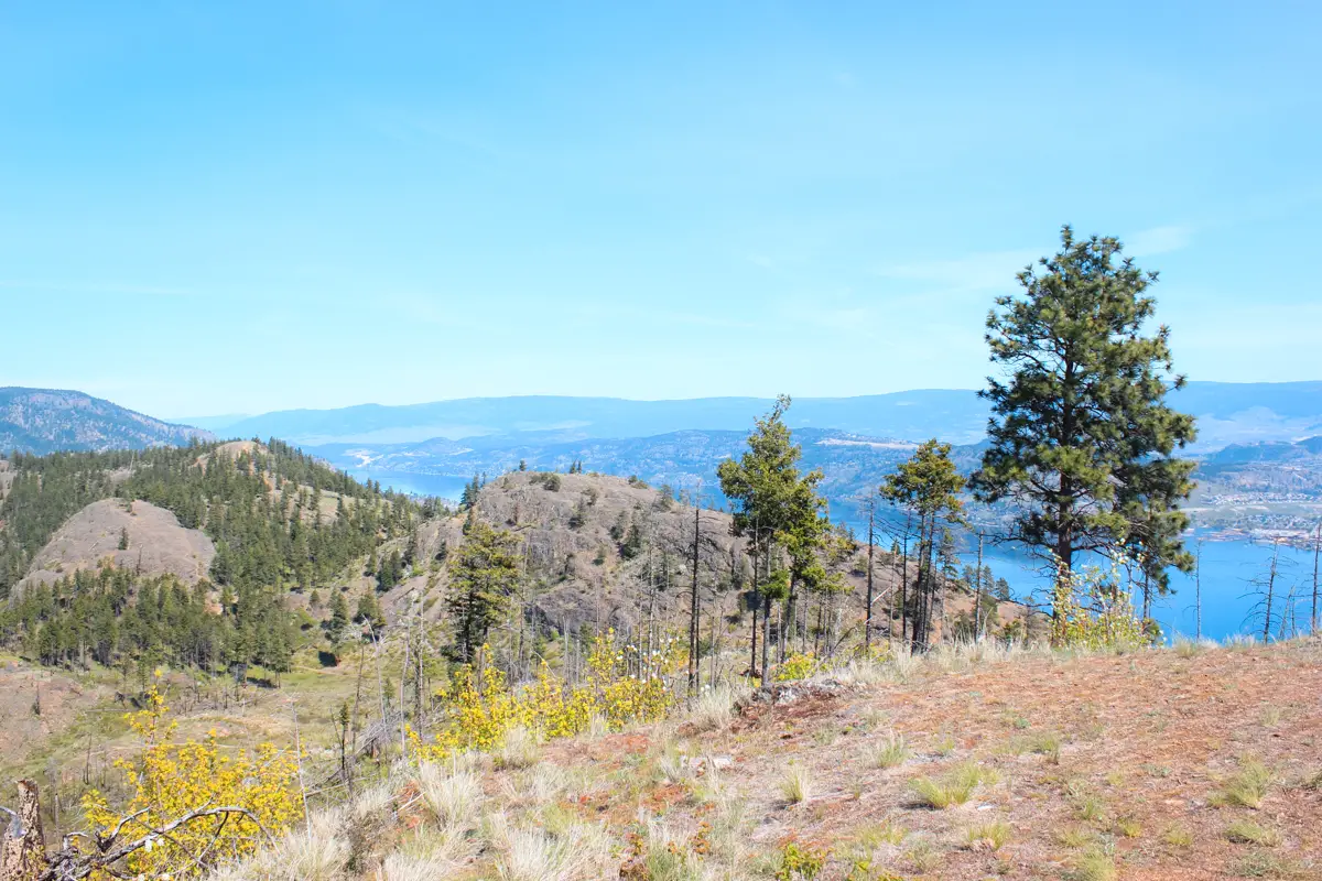 View of mountains around Rose Valley reservoir with Okanagan Lake visible in the background