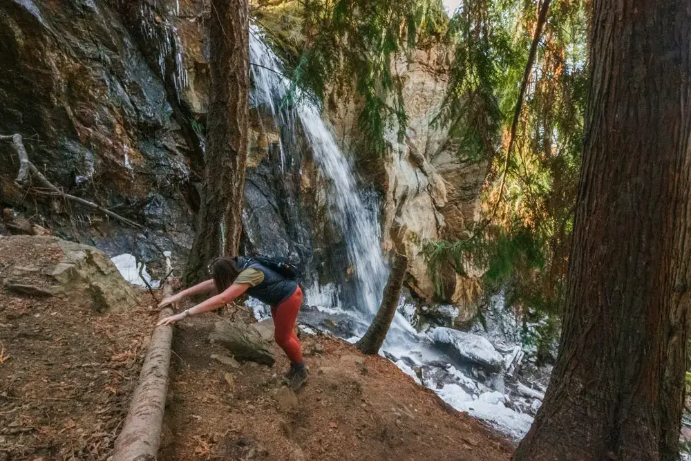 Woman struggles to the Cosens Bay waterfall viewpoint