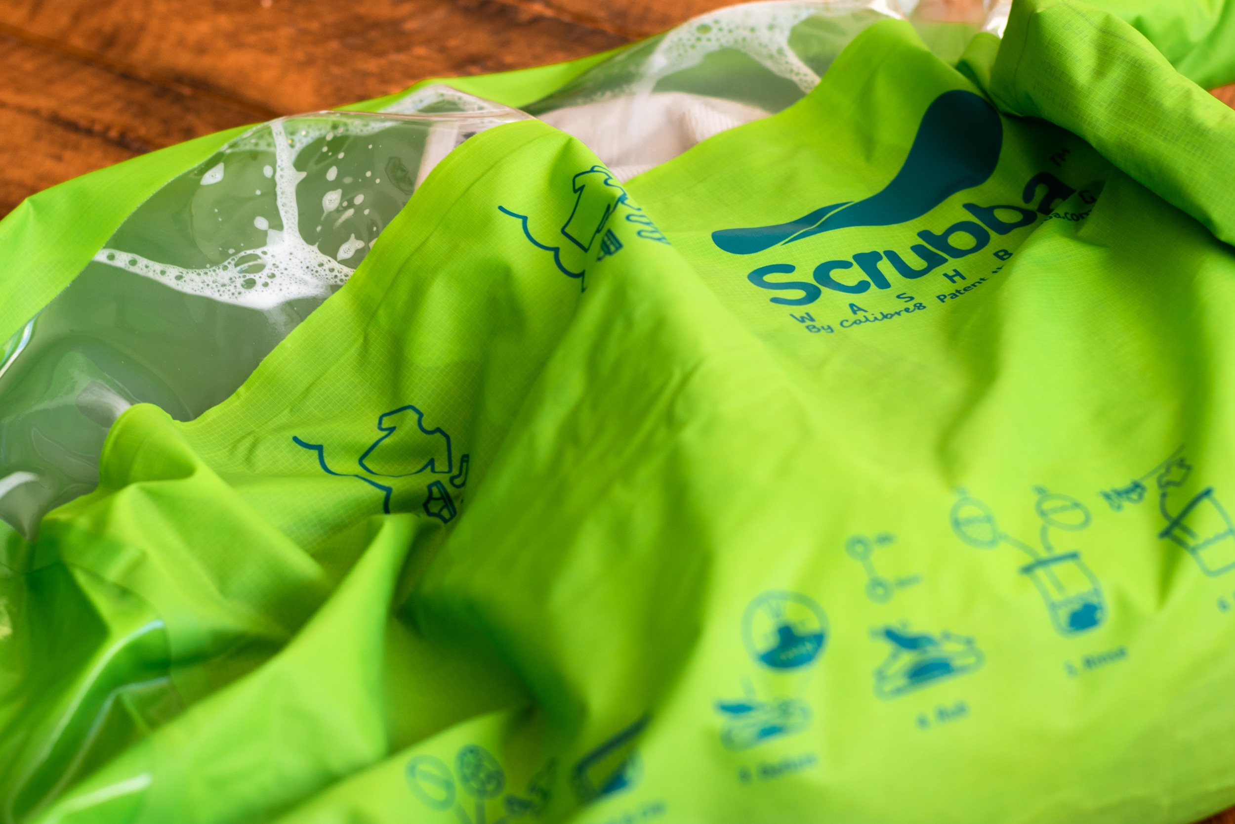 Scrubba wash bag with soapy water inside.