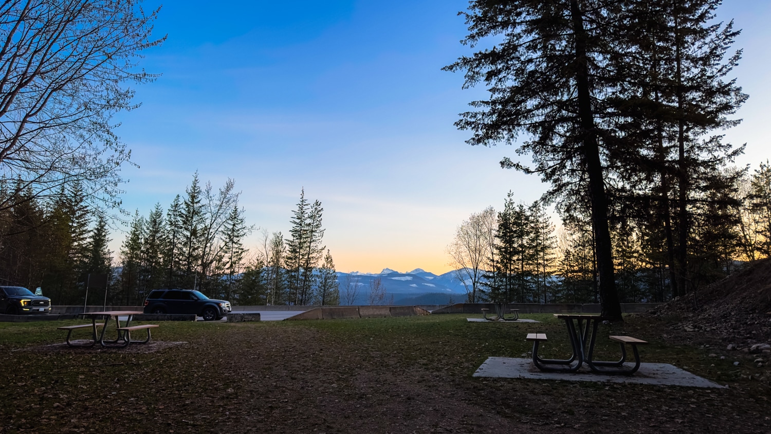 View of the Ione Falls rest stop from the base of the waterfall, looking towards the parking area and lake. Taken just after sunset.