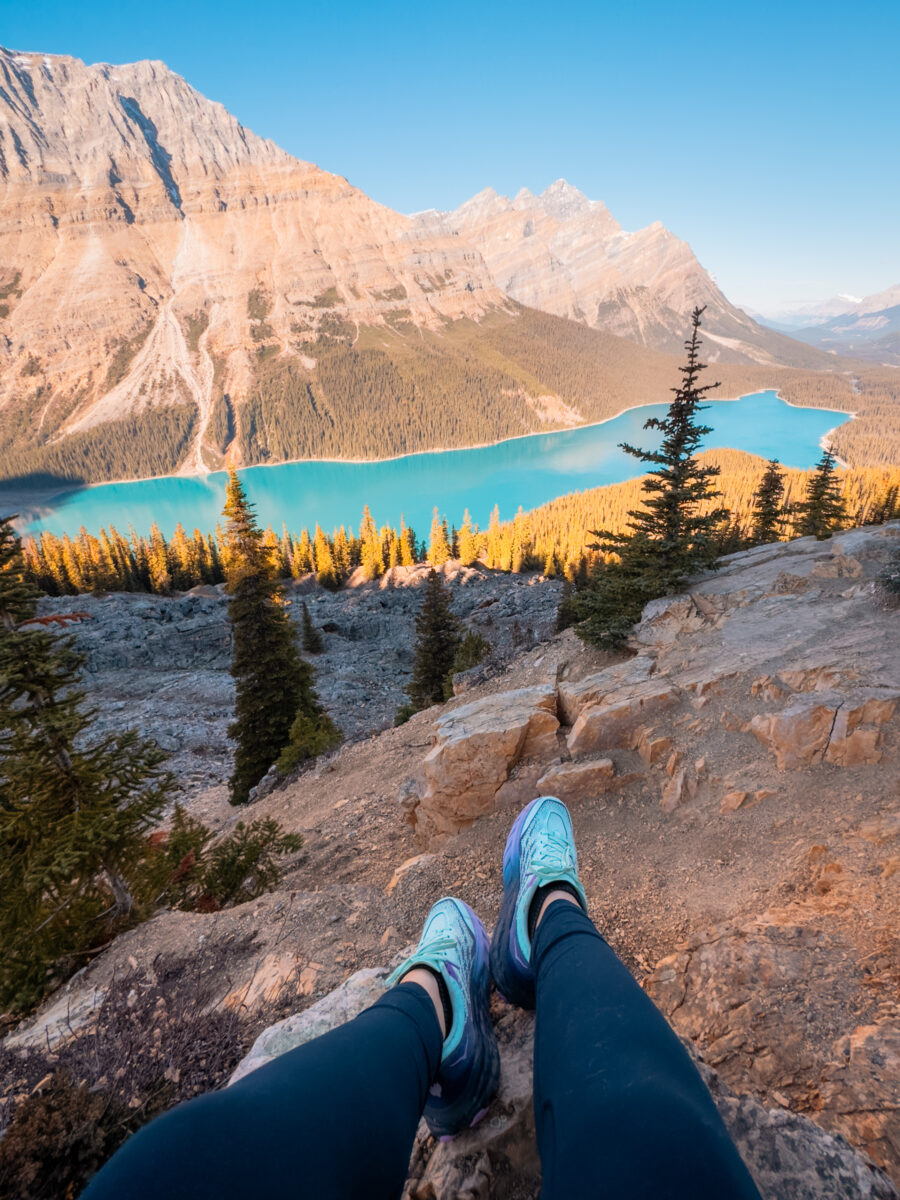 View of Peyto Lake from the viewpoint withHoka shoes in the foreground.