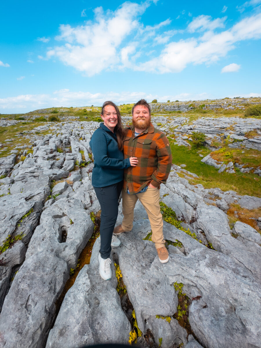 Photo of a couple standing on the limenstone pavement.