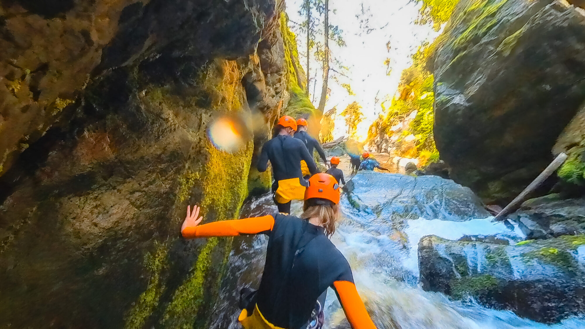 A group walks through a canyon in Kelowna