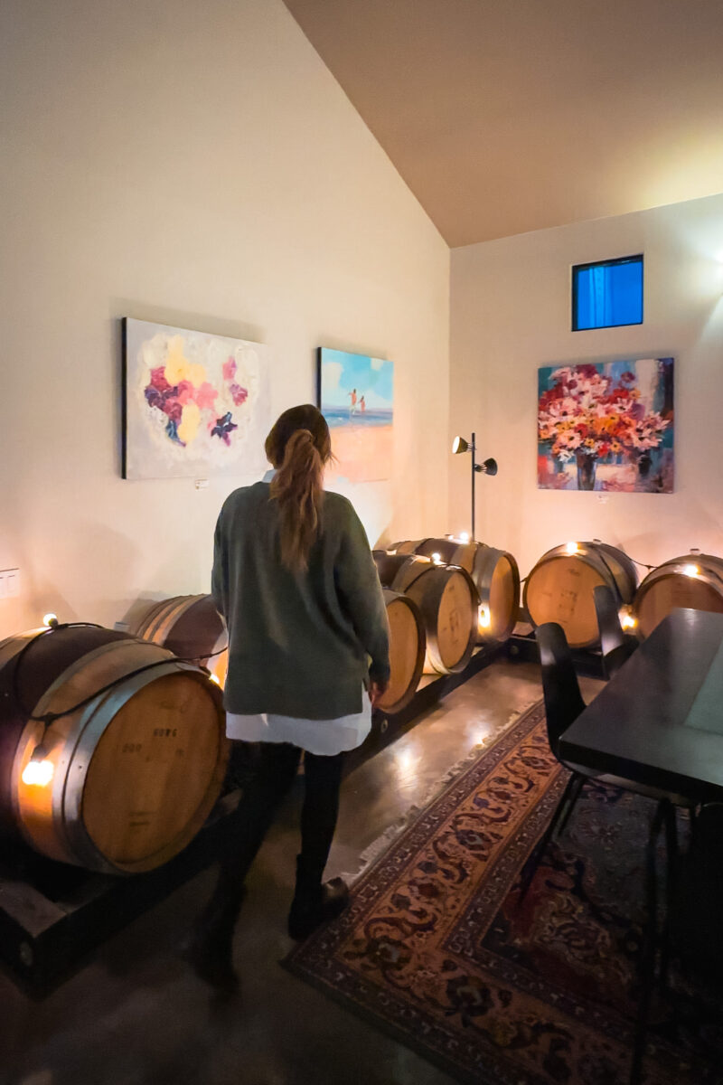 Woman walks through a winery