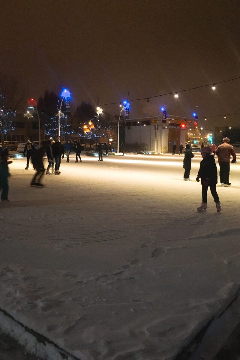 People skating on an outdoor skating rink in downtown Kelowna