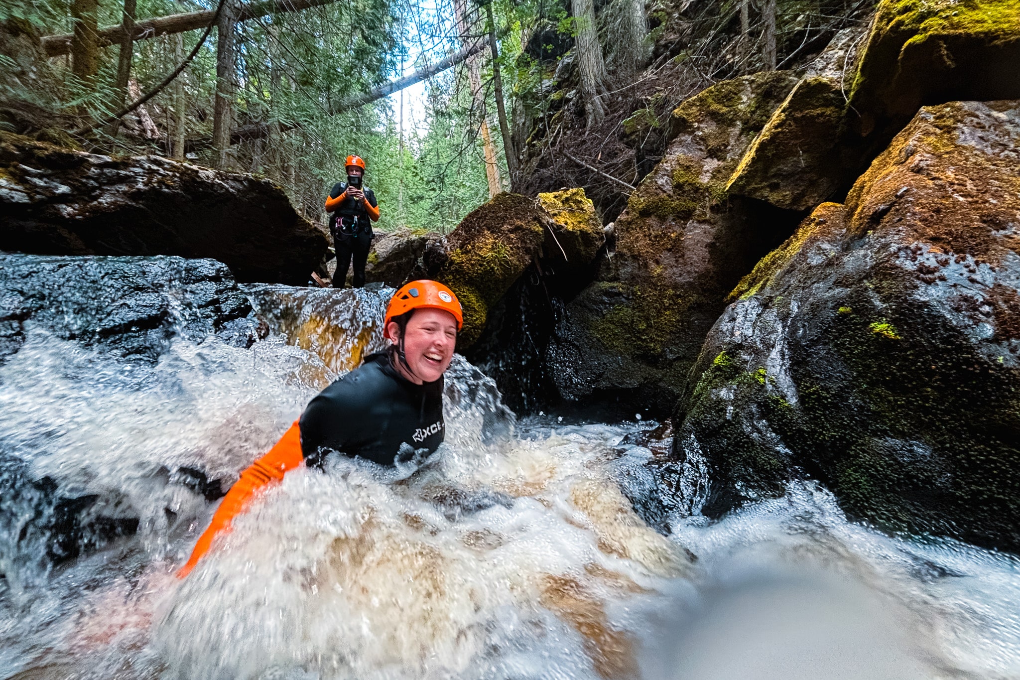 Woman canyoning on an adventure tour in Kelowna.