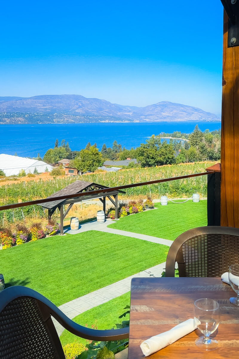 View from Summerhill Winery's dining patio overlooking Okanagan Lake on a sunny summer day in Kelowna.