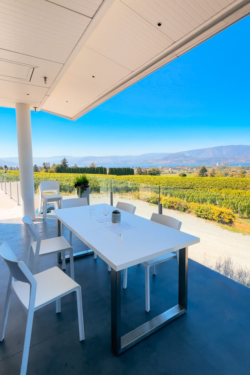 The outdoor tasting table at Tantalus Vineyards overlooking Kelowna and Okanagan lake.