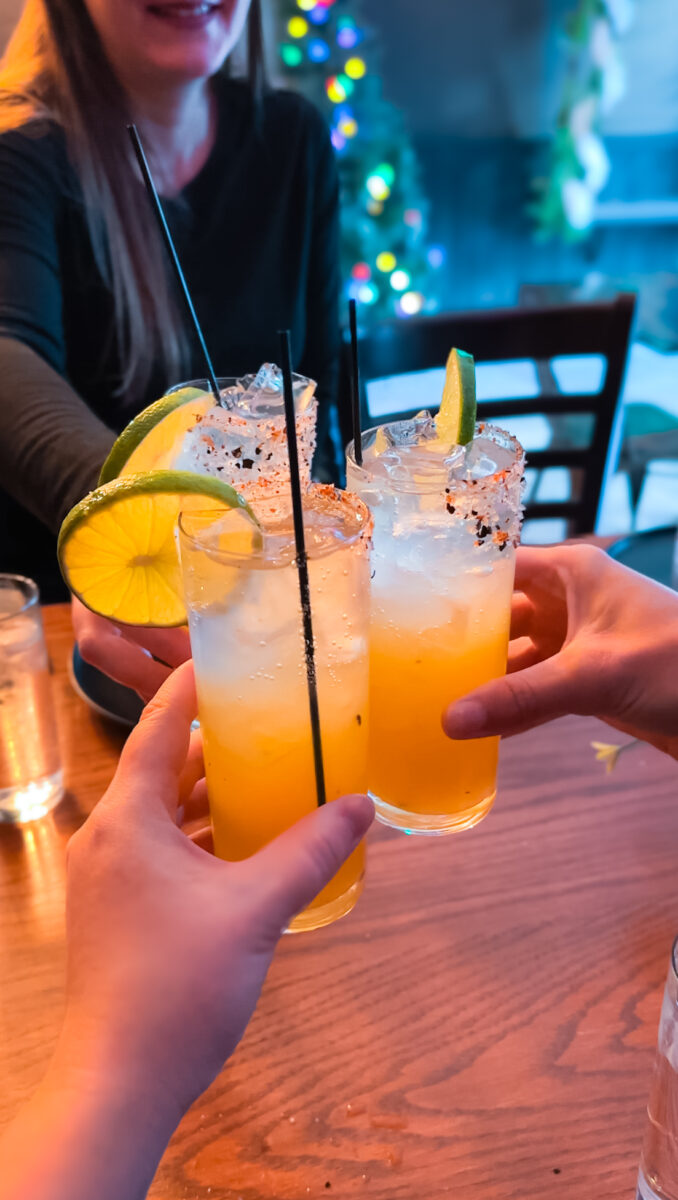 Orange mocktails with a lime wedge at Ten 13, a great Kelowna restaurant.