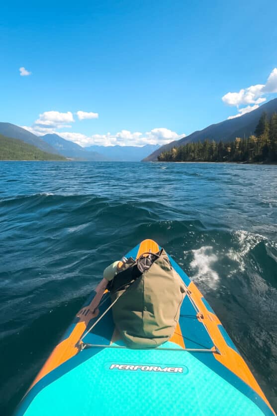 ALPAKA Elements Tote bag strapped to the front of a paddleboard on a rough lake on a camping trip in BC