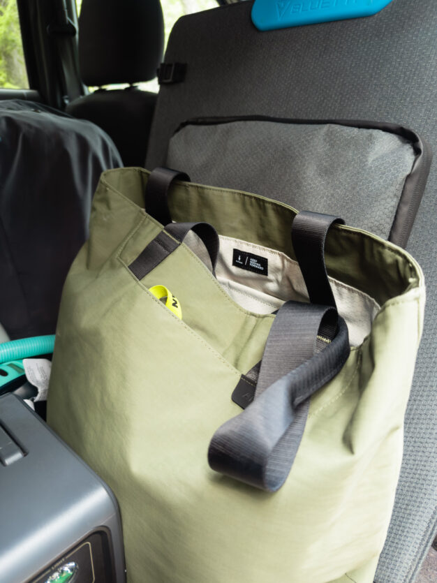 Alpaka Elements tote bag in the back of a car on a road trip